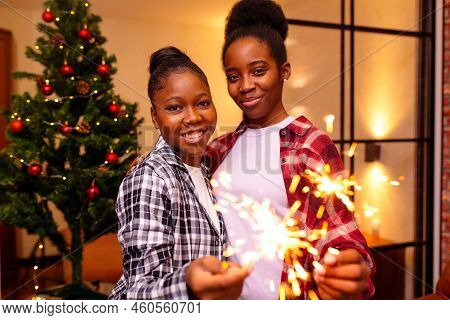 African Women In Pajamas Staying At Home With Sparkers