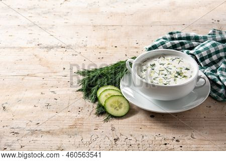 Bulgarian Tarator Sour Milk Soup In Bowl On Wooden Table. Copy Space