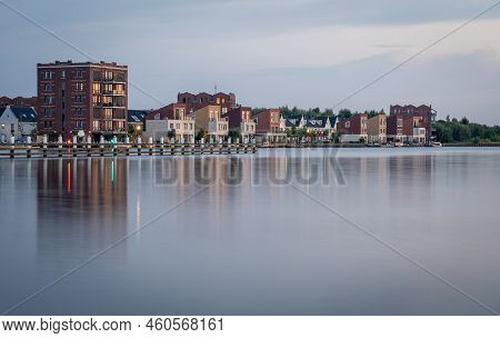 Modern Residential Neighbourhood Along The Lake In The Village Of Spaarndam By Sunset