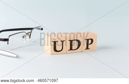 Text Udp - User Datagram Protocol Written On The Wooden Cubes On A Blue Background