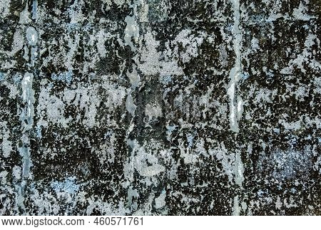 Dirty Old Eroded Cracked Plaster Cement Block Fence. Concrete Block Wall. Destroyed Crumbling Cement
