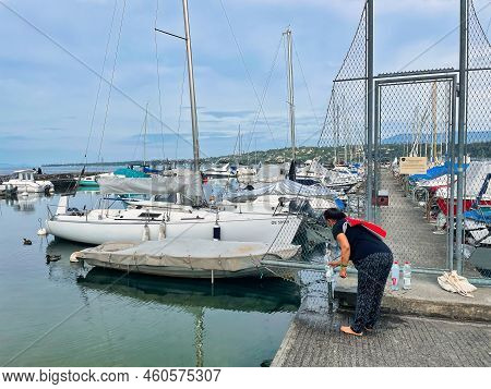 Geneva, Switzerland - September 14 2021: Luxurious And Expensive Yachts Are Docked In A Harbor On La