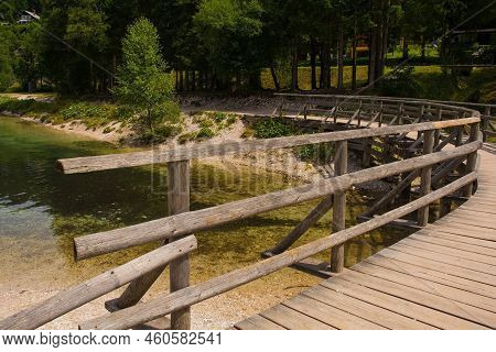 A Wooden Walkway At One End Of Jasna Lake Near Kranjska Gora In The Upper Carniola Region Of North W
