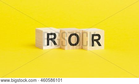 Wooden Blocks With Text Ror - Rate Of Return - On Yellow Paper, Business Concept