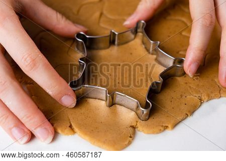 Close Up Woman Hands Cutting Out Cookies With Metal Mold From The Shortcrust Pastry. A Metal Forms I