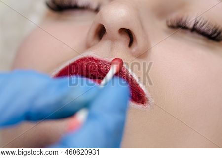 Closeup Of Young Caucasian Woman Face And Lips During A Process Of Permanent Lips Makeup In Tattoo S