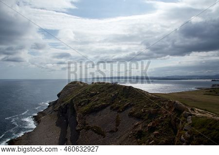 Sky With Clouds, Sea And Land On The Coast. Horizontal Photography.