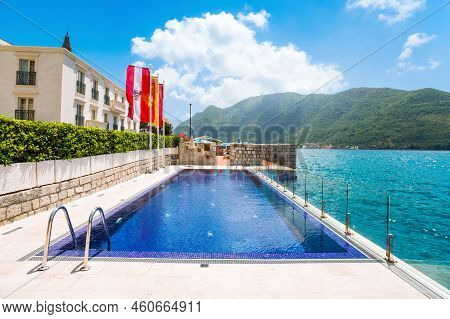 Perast, Montenegro - May 28, 2022: Pool Area In Luxury Hotel Aith Beautiful View To The Shore Of The