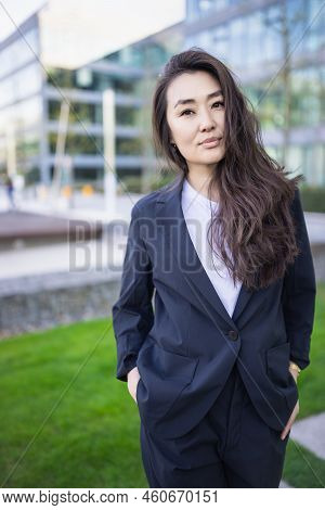 Relaxed And Confident Asian Business Woman In Suit Smiling. Job, Work Aspirational Concept, Backgrou