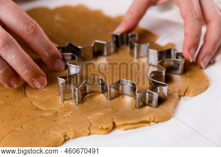 Close Up Woman Hands Cutting Out Cookies With Metal Mold From The Shortcrust Pastry. A Metal Forms I