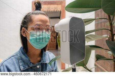 The Asian Tourist Woman Has Checked Body Temperature With A Thermal Temperature Scanner Detector, Ne