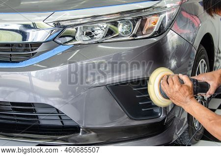 Car Detailing - Male Mechanic Holding Car Polishing Machine. Auto Industry, Car Polishing And Painti