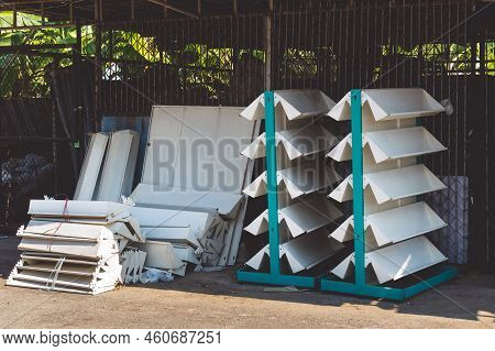 Empty Old Metal Book Or Magazines Shelves. Old Bookshelves That Are No Longer In Use Due To The End 