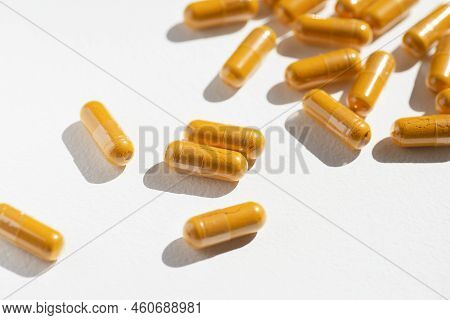 Turmeric Plus Black Pepper Extract Gelatin Capsule Close Up Top View. Herbal Supplement Organic Curc