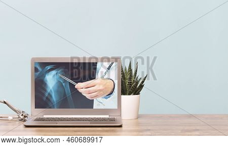 Stethoscope On A Laptop. Virus Season, Pandemic. Remote Medicine Or Elearning And Telemedicine And C