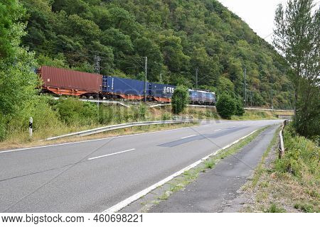Sankt Goar, Germany - 08 04 2022: Freight Train Next To The Road In Mittelrheintal