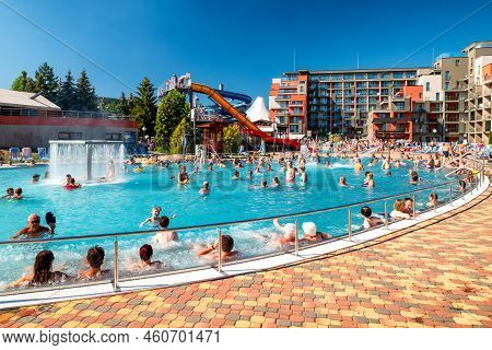 Besenova, Slovakia - July 25, 2022: People Relaxing In Pool At Waterpark During Summer Hot Day In Vi