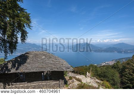 View Of Lake Maggiore From The Giardino Botanico Alpinia Near Stresa. Stresa Is A Town In Piedmont I