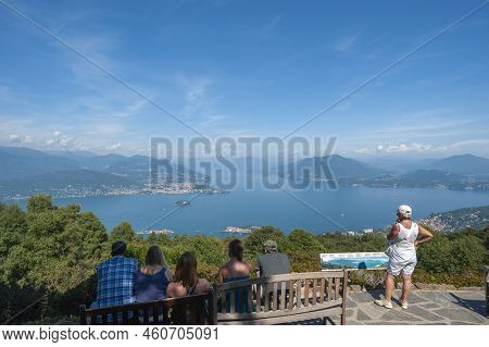 Stresa, Italy - August 17, 2018: Tourists In The Giardino Botanico Alpinia Park Overlooking Lake Mag