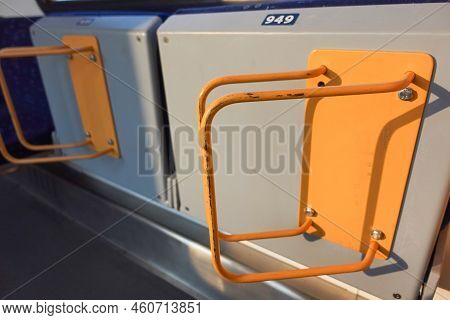 Bicycle Racks On A Train Separated By A Shadow