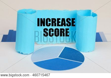 Business Concept. On The Blue Diagram And Graphs There Is A Twisted Paper Plate With The Inscription