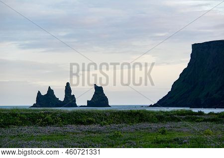 Reynisdrangar Basalt Sea Stack Rocks In Iceland Near Vik I Myrdal At Sunset