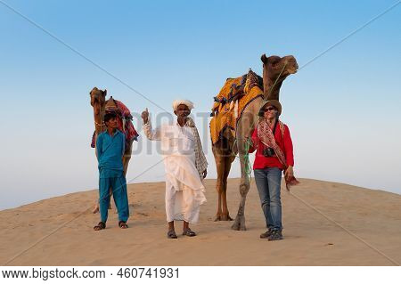 Thar Desert, Rajasthan, India - 15th October 2019 : Female Tourist Posing With Camel, Camelus Dromed