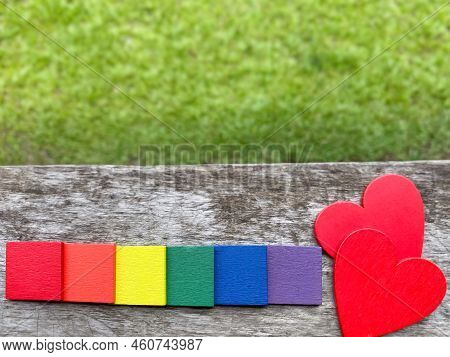 Wooden Multicoloured Rectangles With Wooden Red Hearts Background. Abstract Concept. Stock Photo.