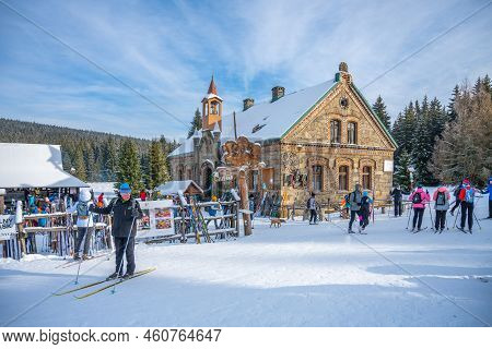 Orle, Poland - January 16, 2022: Historical Tourist Hut On Sunny Winter Day With Cross-country Skier