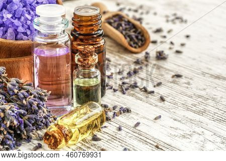 Lavender's Spa Products With Dried Lavender Flowers On A Wooden Table. Flat Lay Bath Salt And Massag