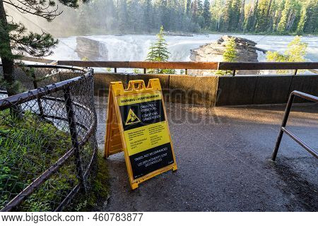 Alberta, Canada - July 13, 2022: Warning Sign Of Dangerous Conditions At Athabasca Falls In Jasper N