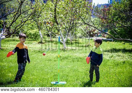 Two Friends Are Playing Tetherball Swing Ball Game In Summer Camping. Two Boy Brother Happy Leisure