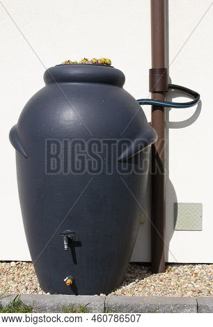 Rainwater Barrel Connected To The Gutter, Water Saving Concept