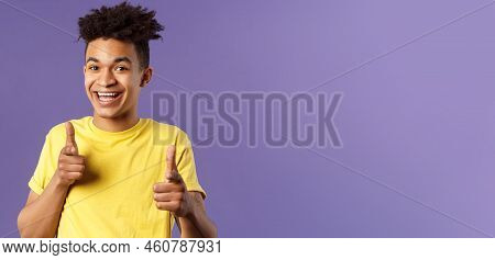 Believe In You. Portrait Of Cheerful Young Optimistic Guy Encuraging To Keep Going, Pointing Fingers