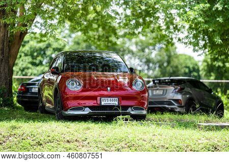 Chonburi Province, Thailand – 29 Jul 2022, Ora Red Car With Auspicious Number Was Parked Under The T