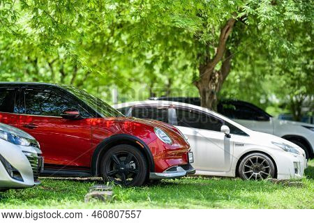 Chonburi Province, Thailand – 29 Jul 2022, Ora Red Car With Auspicious Number Was Parked Under The T