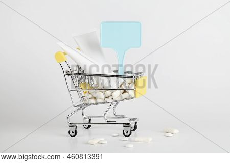 Titanium Dioxide, E171, Dangerous Additive Concept. Gum, Pills, Toothpaste, Cream In Basket And Sign