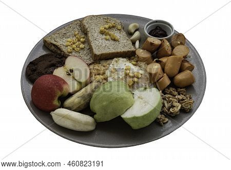 Breakfast On A Ceramic Plate With Fried Sausages, Fried Eggs, Sweet Corn Kernels To Put It On Top Br