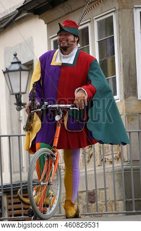 Hamelin, Germany - July 16 2017 The Pied Piper Of Hamelin, Dressed In Multicolored Clothes, Rides A 