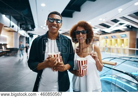 A Man And A Young Woman Go To The Cinema. Watching A Movie With Popcorn And 3d Glasses.