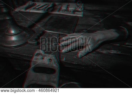 A Dark And Terrifying Torture Room. A Bloody Saw, Medical Instruments And A Severed Hand. Close-up. 