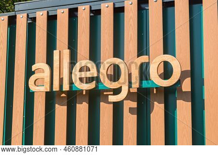 Gdansk, Poland - July 5, 2022: Detail Of Allegro Parcel Locker With Wooden Logo Of Allegro.