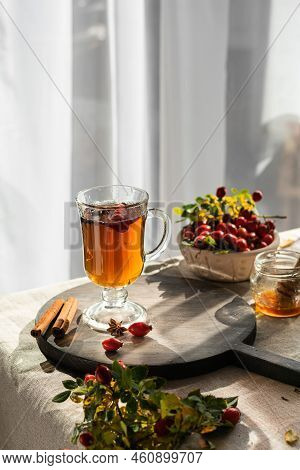 Rosehip Hearbal Tea On Wooden Board. Vertical