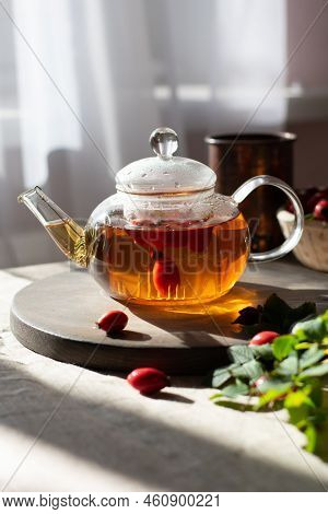 Rosehip Hearbal Tea On Wooden Board. Vertical