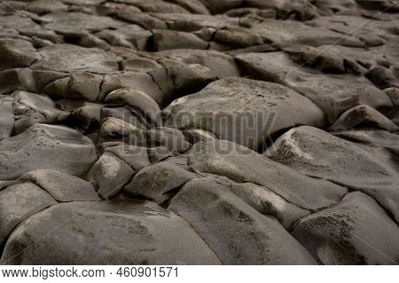 Wet Stones Of Kilve Beach On A Cloudy Rainy Day, Coast Of England