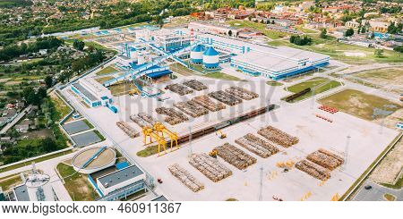 Aerial View Of Modern Paper Mill In Summer Sunny Day. Birds-eye View Of Raw Timber At Paper Factory.
