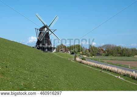 Panoramic Image Of The Windmill Of Pellworm Against Blue Sky, North Frisia, Germany
