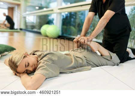 Yumeiho Therapy. Massage Therapist Doing Massage Using Oriental Techniques Yumeiho For Correcting Po