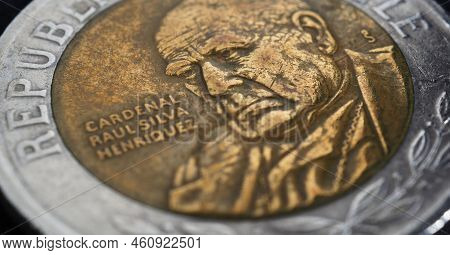 Translation: Republic Of Chile. Coin Of 500 Chilean Pesos Close-up. Peso Of Chile. News About Econom