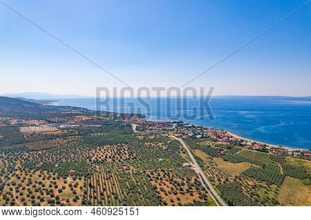 Beautiful Aerial View At Torones Kolpos. Clear Blue Sky, And Amazing Dark Blue Sea Water. Greek Hous